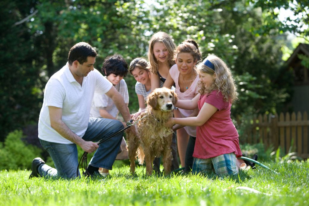 Happy family outside with dog