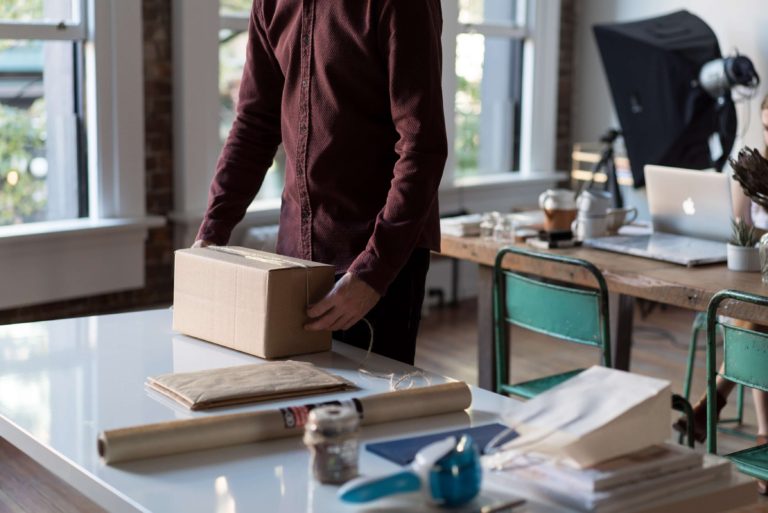 A man packing up orders