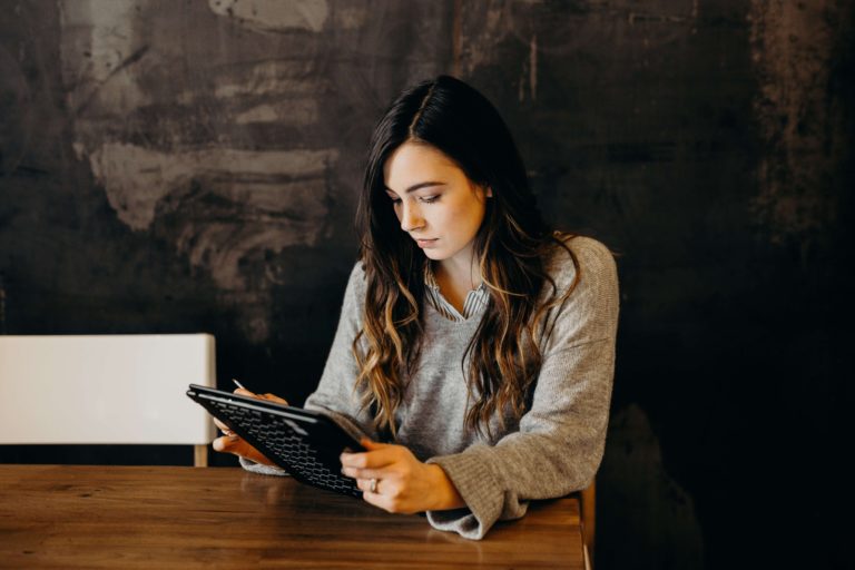 Sales woman looking at ipad