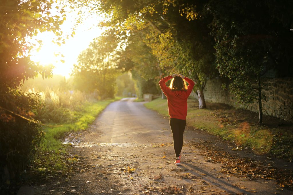 woman walking on a country path