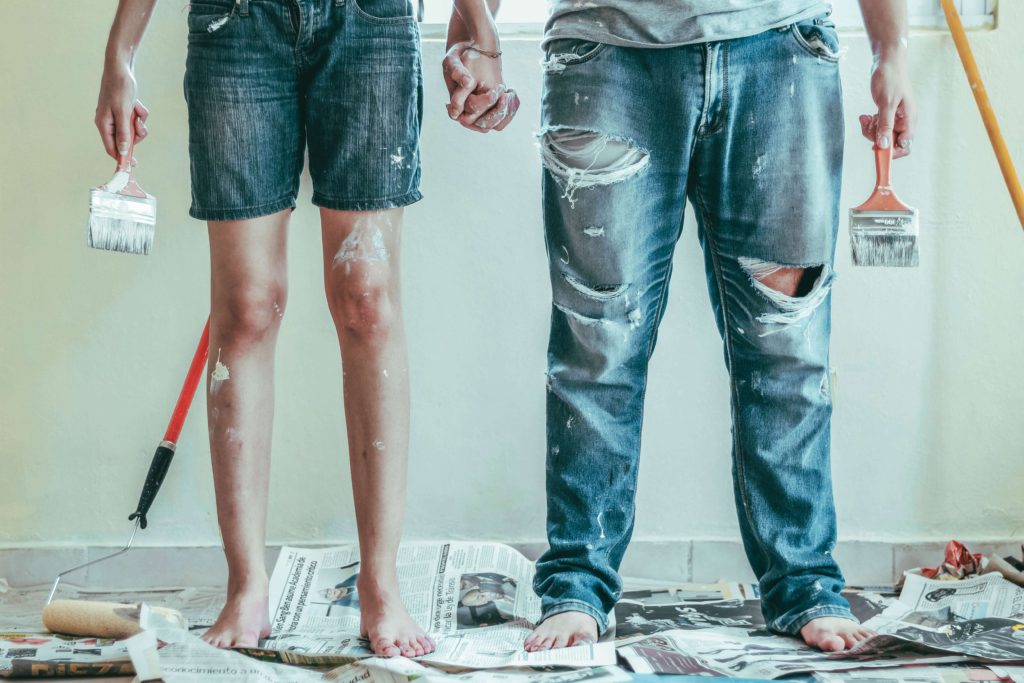 couple painting a new house together
