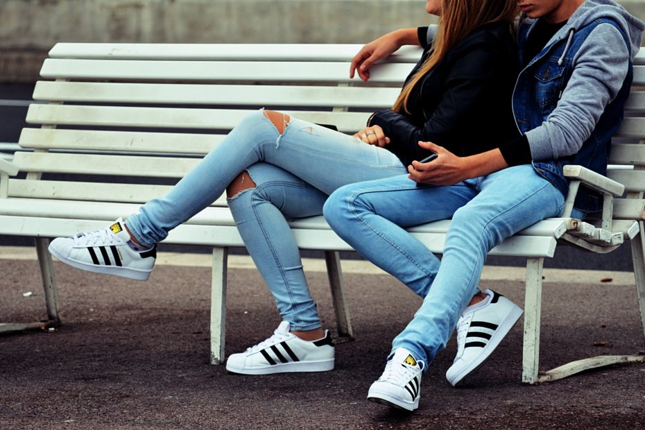 Couple sitting on bench together