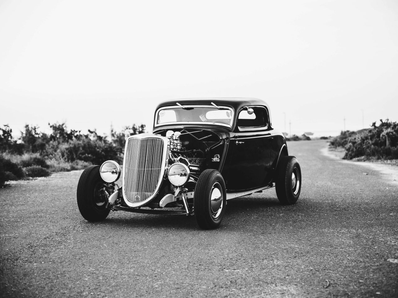 black and white picture of an old fashioned car